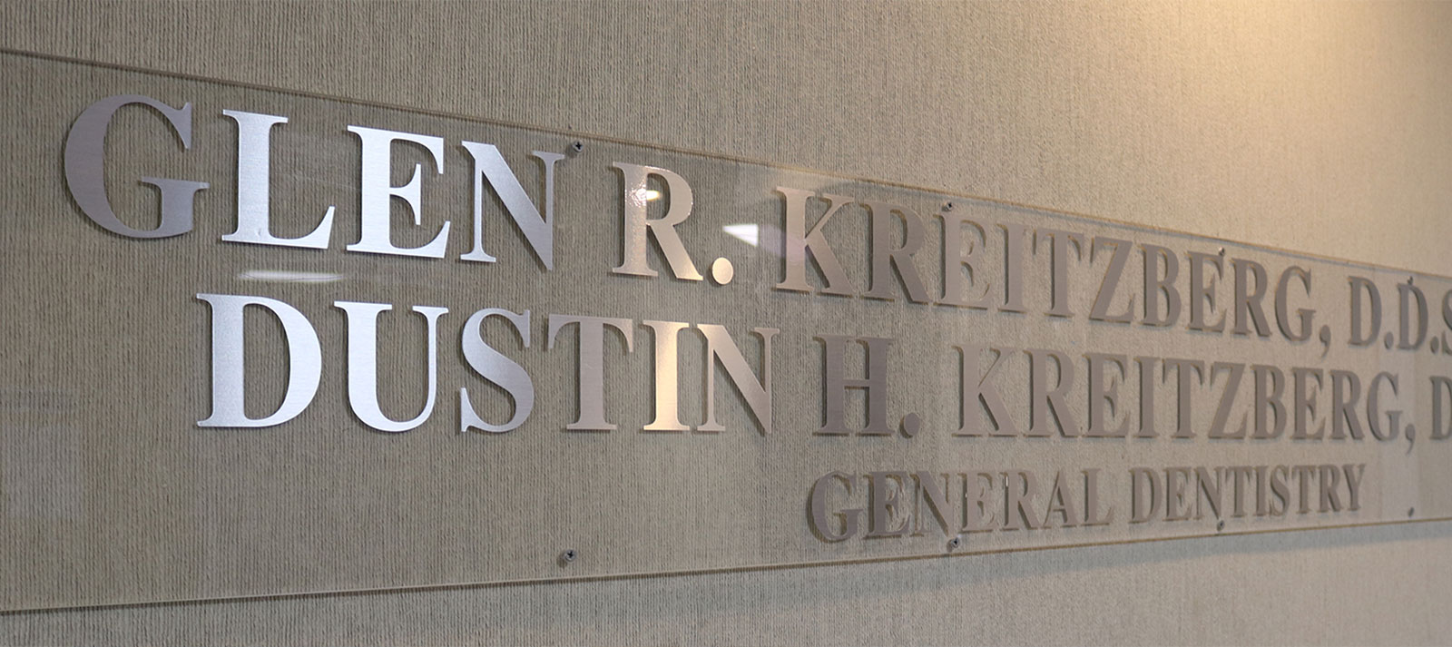 The image shows a sign with the name Glen R. Kretzberg prominently displayed, indicating that this is likely an establishment or organization related to dental care, as suggested by the text below the name that reads General Dental.